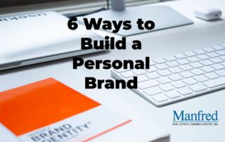 a computer and a book on brand identity, ways to build a personal brand as a real estate agent