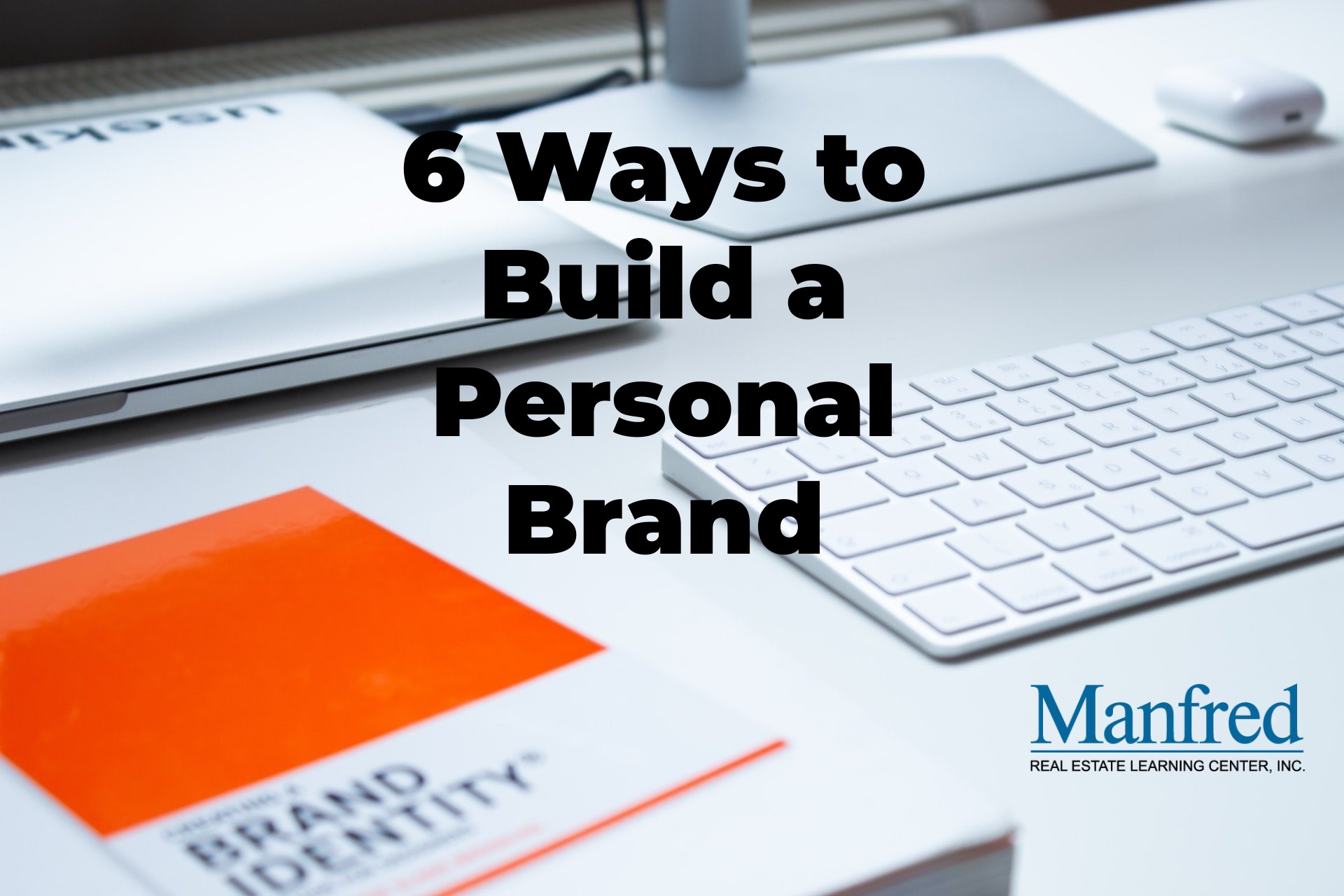 a computer and a book on brand identity, ways to build a personal brand as a real estate agent