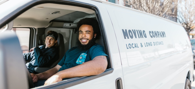 Two guys working for a moving company.