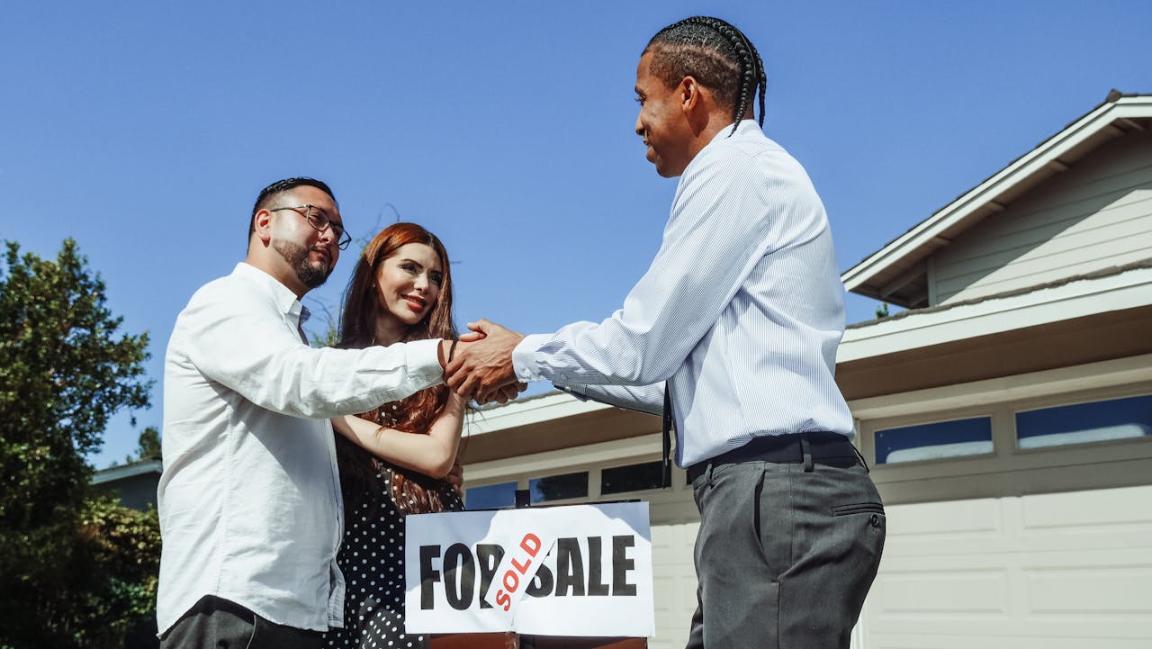 Man shaking hands with a real estate agent