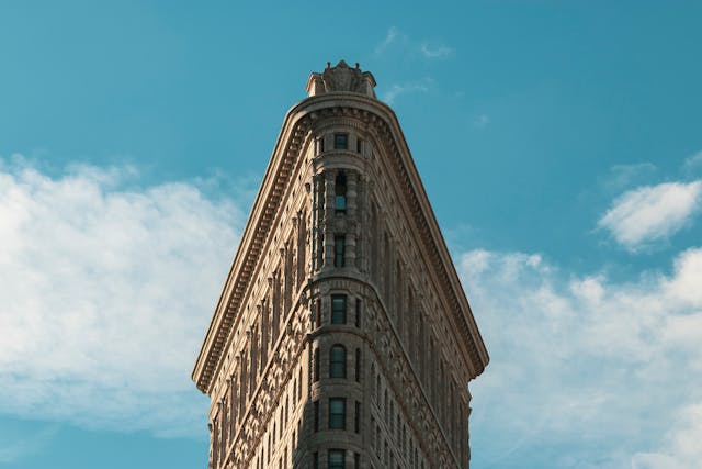 New York, United States, Flat Iron Building against the blue sky.